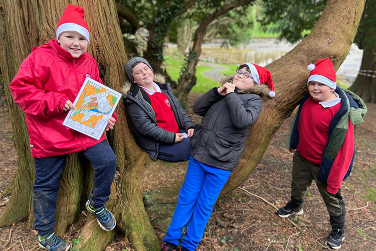 Children wearing Father Christmas hats