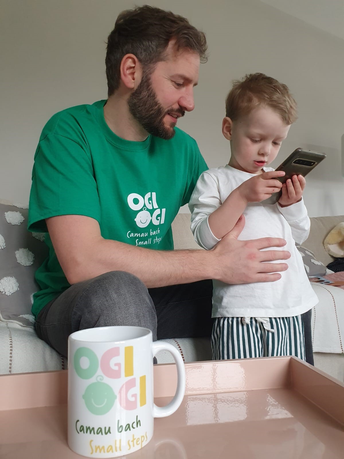 Jamie from Malltraeth and his son Seb (3) learn more about the new OgiOgi app.