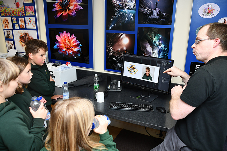 Pupils looking at a computer screen.